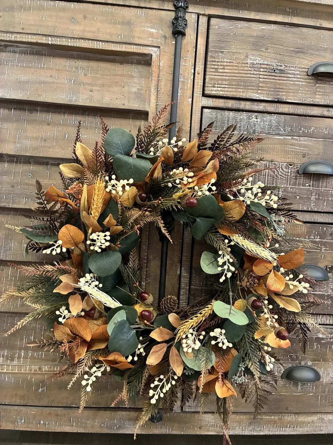 Close-up of handcrafted wreath foliage and berries